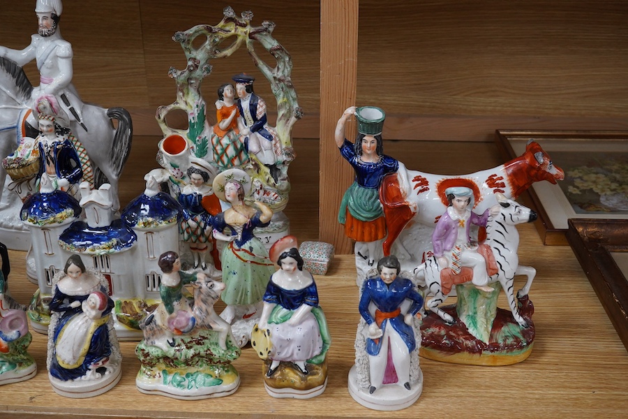 A collection of twenty Staffordshire flatback figures or models to include D. Turpin and Empress of France, largest 36cm high. Condition - fair, some restored